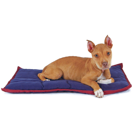 Tan puppy lying on a navy Jeffers washable crate pad with wine red trim