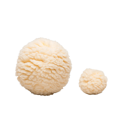 HuggleFleece Plush Ball dog toy in Large and Small side by side, fluffy cream fleece on a white background