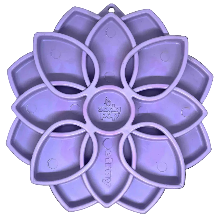 SodaPup Mandala Softie eTray, a flower-shaped lick tray in pastel purple, top view of the petal wells