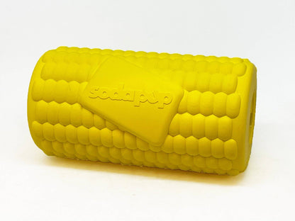 Corn on the Cob treat toy lying on its side, molded kernels and the raised SodaPup logo tag in view