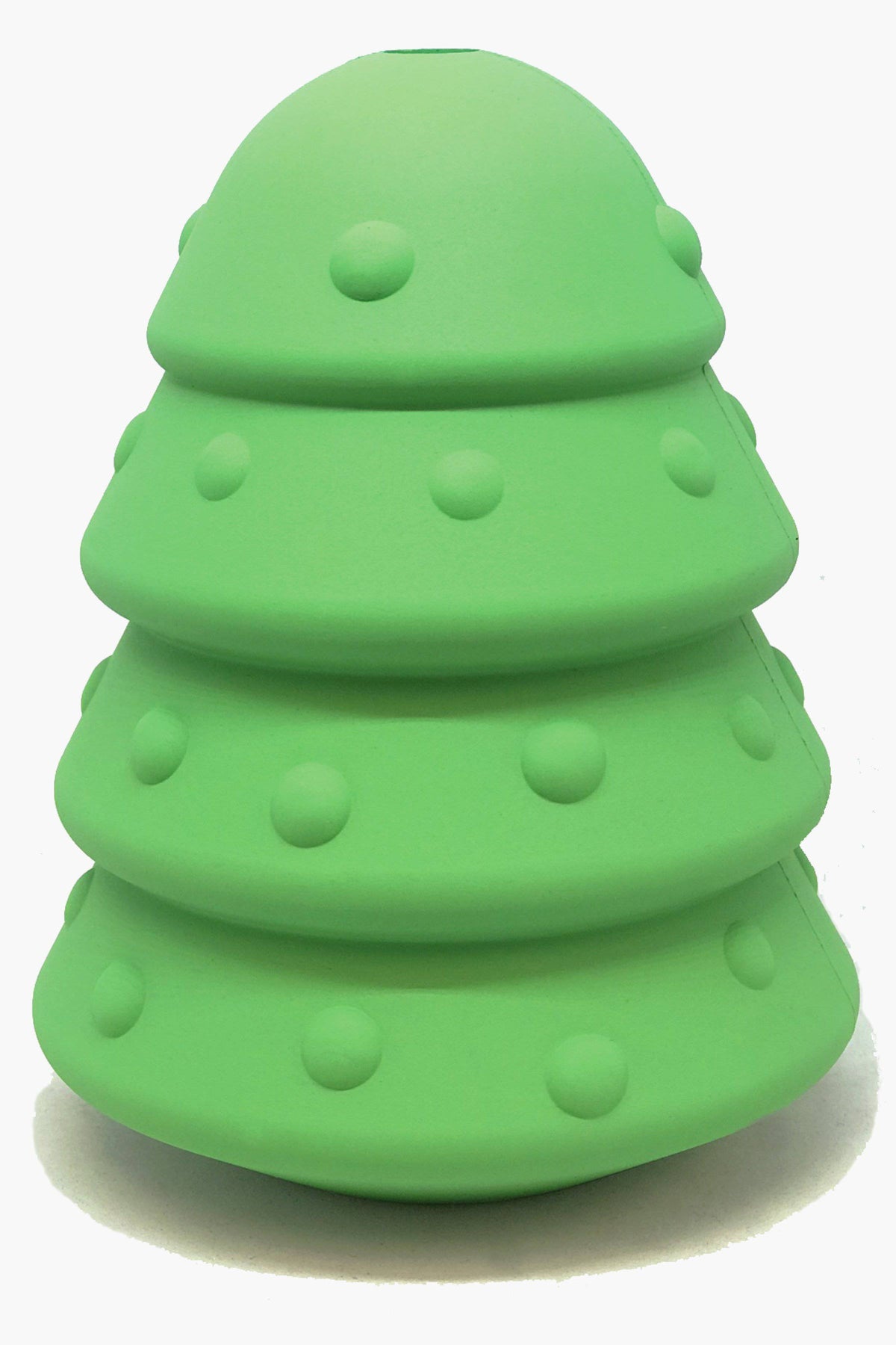 Christmas Tree treat dispenser standing upright on a pale studio backdrop, four tiers dotted with raised ornaments