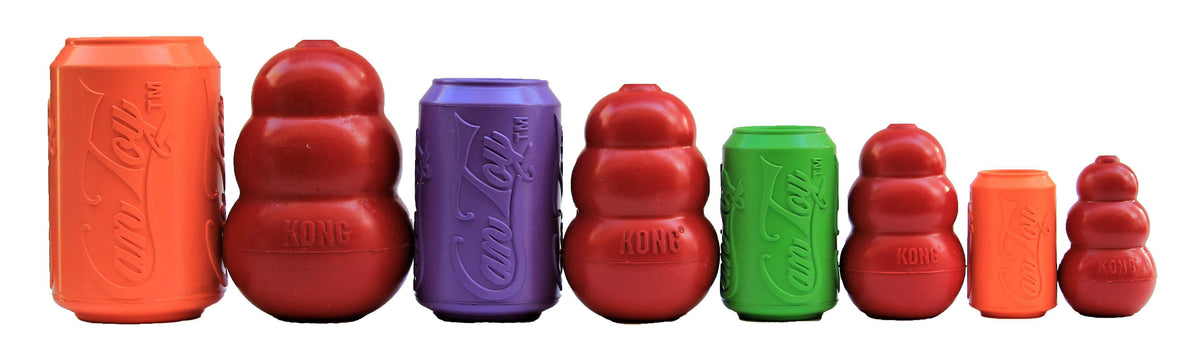 Four SodaPup Can Toys in orange, purple, green, and orange lined up beside similar red rubber toys for size comparison