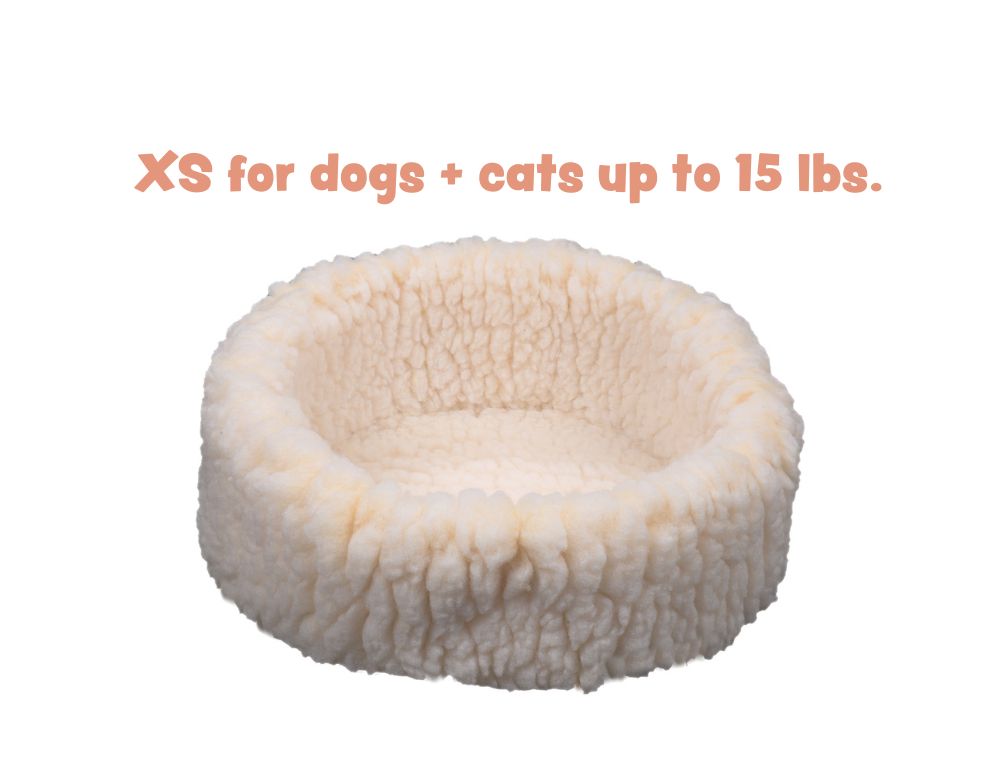 HuggleSnuggler fleece bed in natural cream, side view of the rim, captioned XS for dogs and cats up to 15 lbs