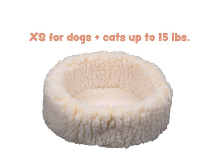 HuggleSnuggler fleece bed in natural cream, side view of the rim, captioned XS for dogs and cats up to 15 lbs